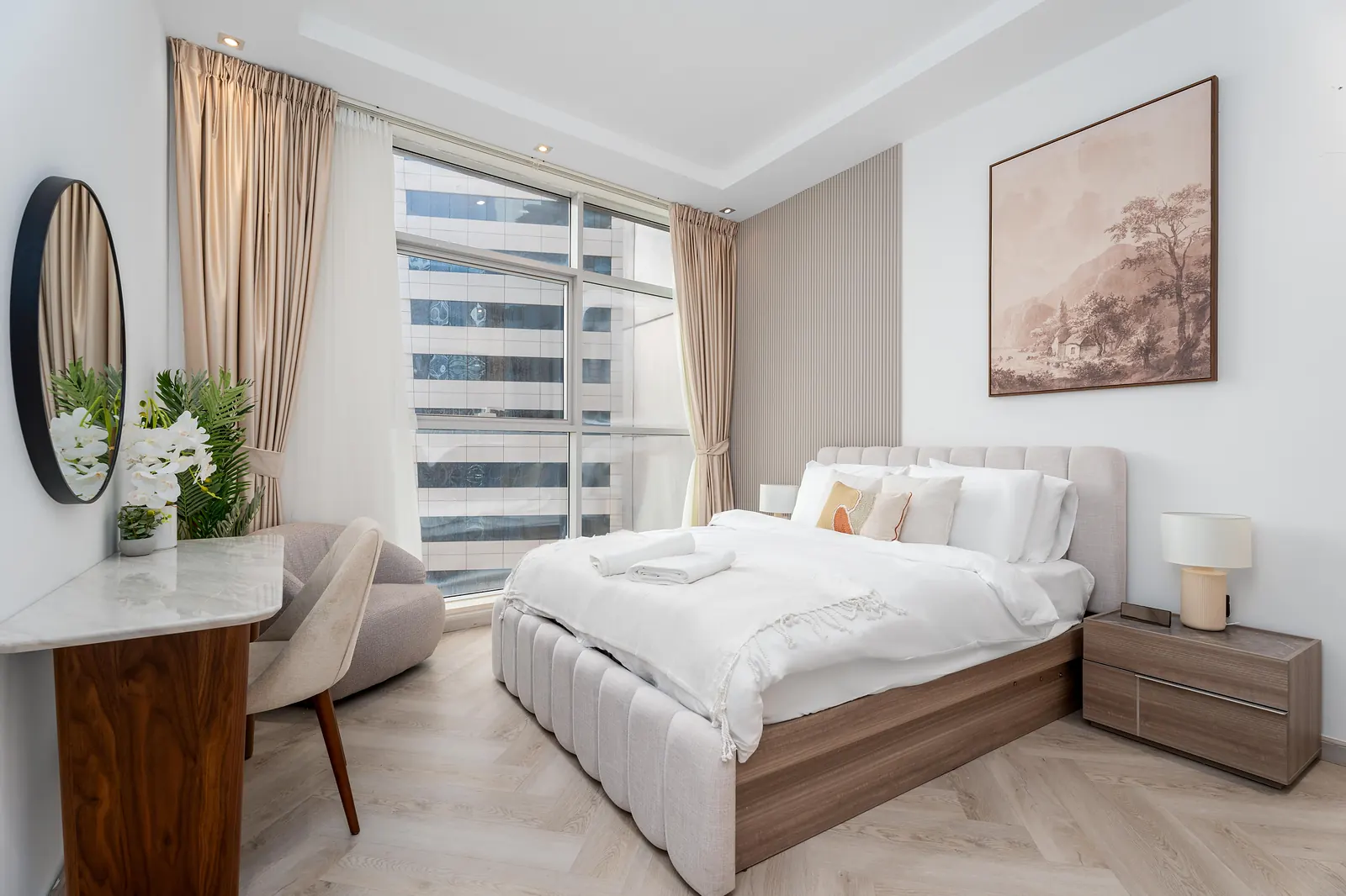 Third bedroom with a slatted panel wall, landscape art and bedside lamps